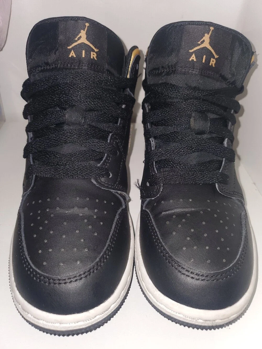 Nike Air Jordan 1 Mid Black/Gold Low-Top Sneakers